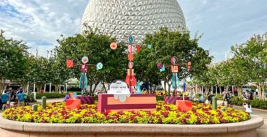 2023 wdw epcot food and wine festival entrance planter atmo 2 700x525