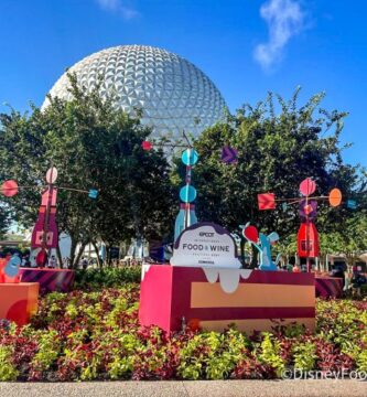 2024 EPCOT Meals and Wine Pageant 3 2024 wdw epcot international food and wine festival entrance planter display atmo 700x525
