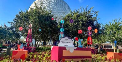2024 wdw epcot international food and wine festival entrance planter display atmo 700x525