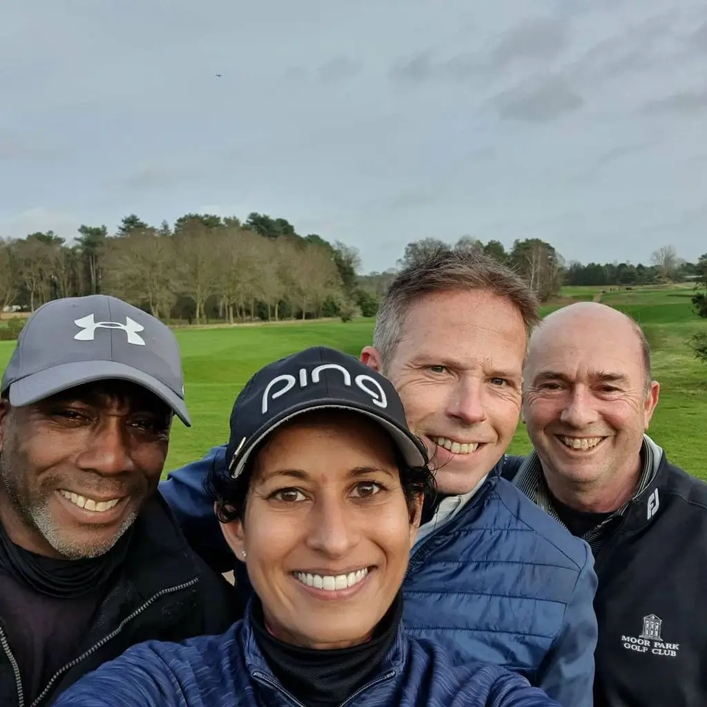 Naga Munchetty and her husband James with friends on a golf course, close-up