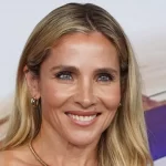 Elsa Pataky shows off her buff physique in a super tight silver mini dress