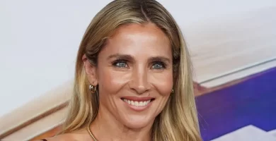 Elsa Pataky shows off her buff physique in a super tight silver mini dress