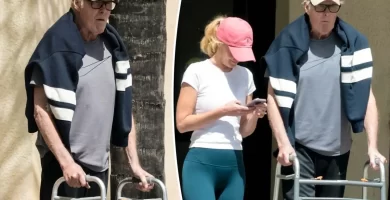 David Hasselhoff uses a walker during a rare outing with his wife Hayley Roberts