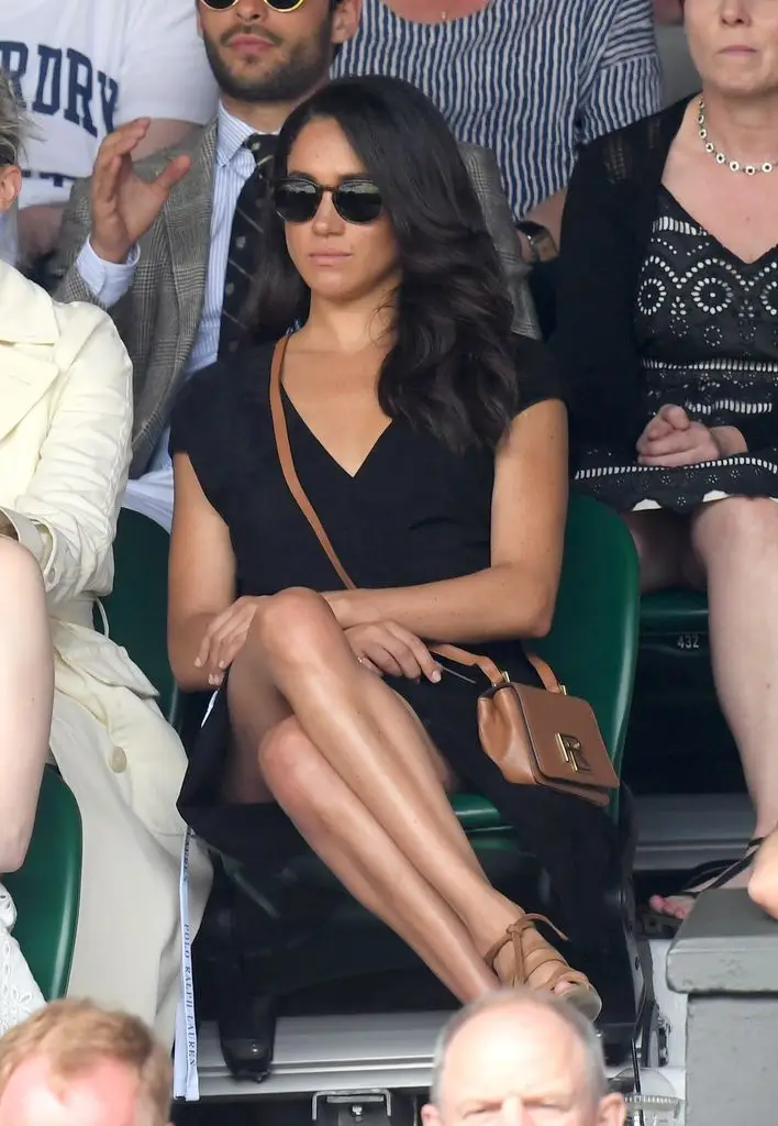Meghan Markle in black dress sat watching Wimbledon tennis championships  