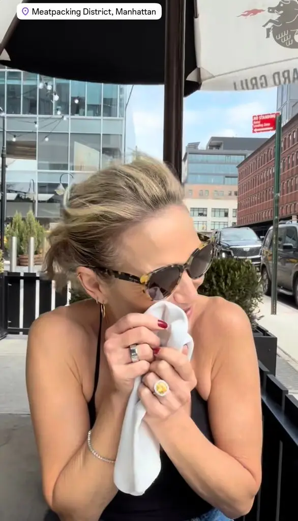 Excerpt from a video shared by TJ Holmes on April 1 of Amy Robach's engagement ring on display