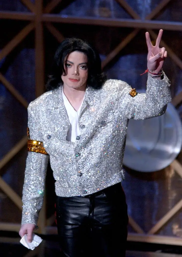 Singer Michael Jackson accepts his Peformer of the Century award at the 29th annual American Music Awards at the Shrine Auditorium on January 9, 2002 in Los Angeles, California. (Photo by Vince Bucci/Getty Images)