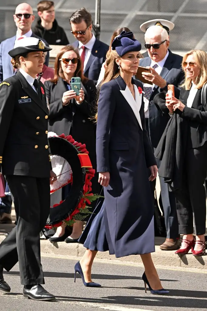 Lieutenant Francesca Hlavac, Royal New Zealand Navy, and Princess Kate attend the wreath laying and parade as part of ANZAC Day commemorations at the Cenotaph.