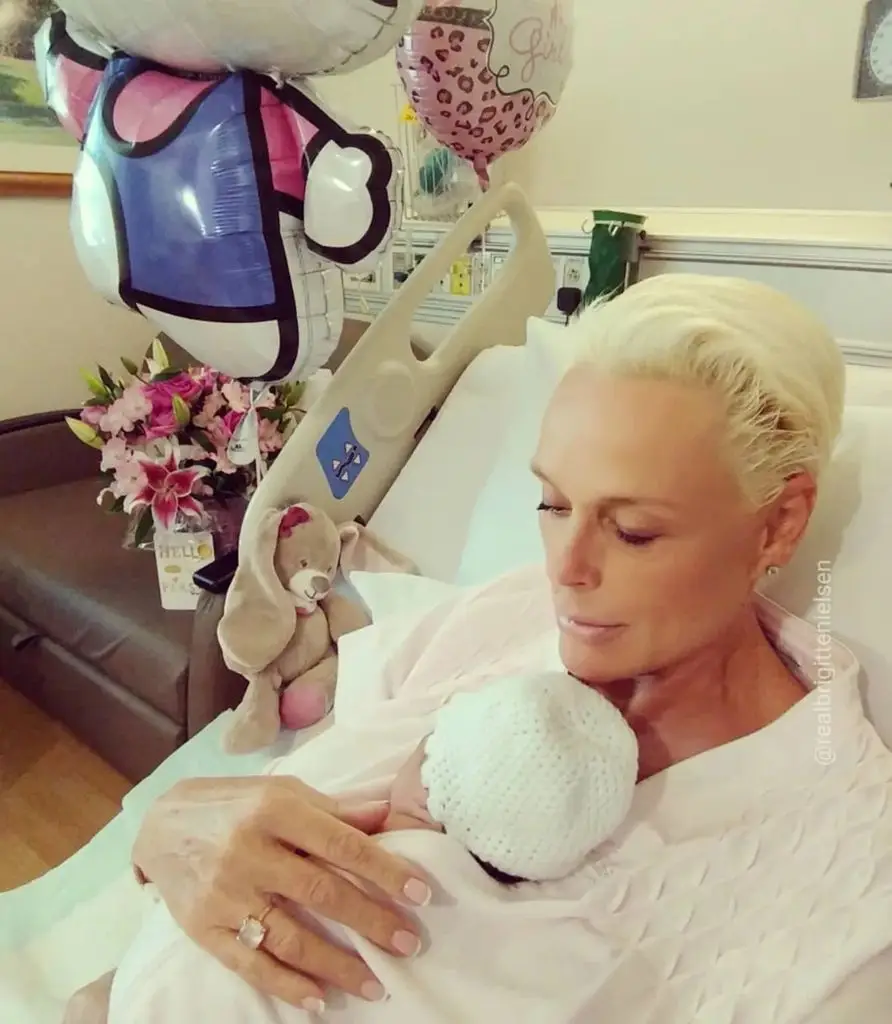 photo of Brigitte Nielsen holding her baby girl after birth