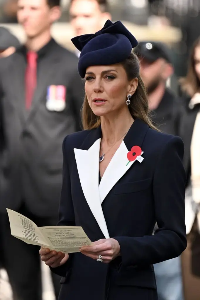 Princess Kate sings as she attends the wreath laying and parade as part of ANZAC Day commemorations at the Cenotaph.