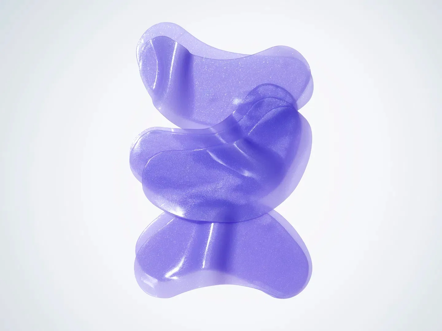 Stack of three purple eye masks with highlights.