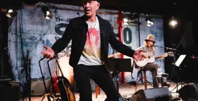 John McEnroe storms the stage throughout Linda Perry's present 8 John McEnroe storms the stage during Linda Perry's show