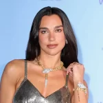 Dua Lipa is the ultimate showgirl in a shimmering plunging mini dress in Cannes