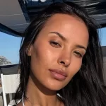 Maya Jama is all legs and poses as a sizzling summer pin-up in a tiny swimsuit and sky-high heels.