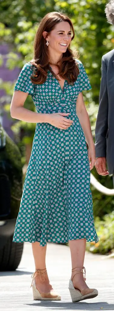 Kate in a green printed midi dress