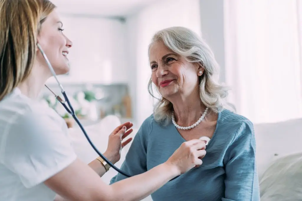 lung examination of a woman by a doctor