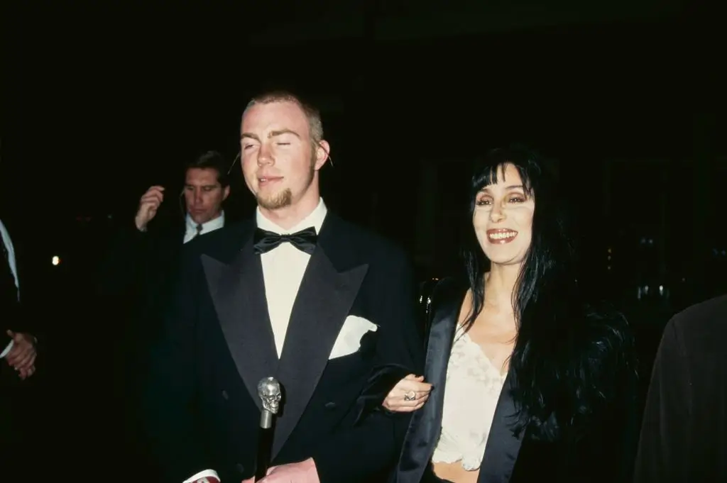 Elijah Blue Allman and American singer and actress Cher attend the 5th Annual Fire and Ice Ball Benefiting the Revlon UCLA Women Cancer Center held at the 20th Century Fox Studios in Century City, California, United States on December 7, 1994.