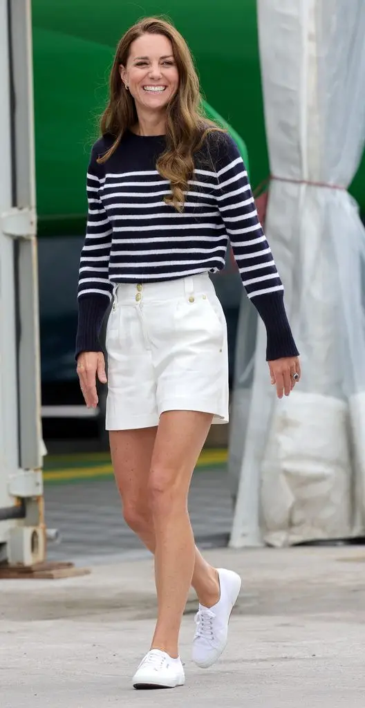 Kate Middleton, Princess of Wales, wears white shorts and a Breton striped top