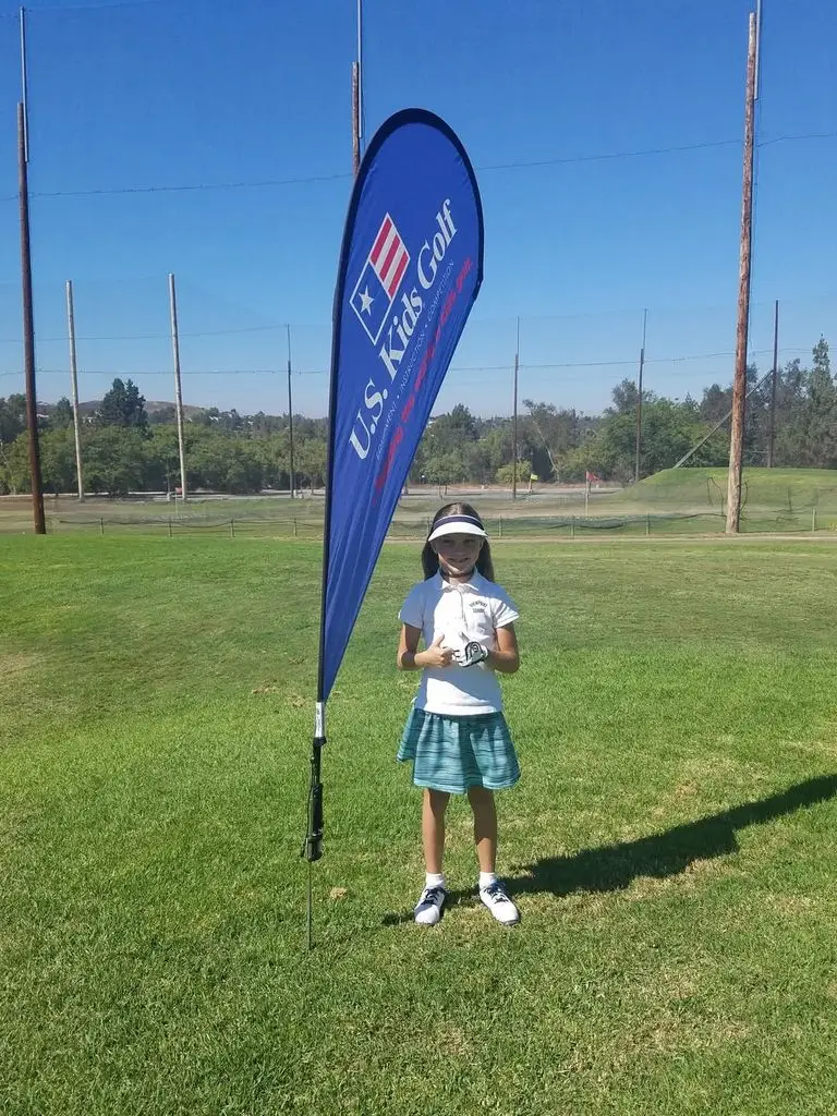 Bailey as a child at a golf tournament 