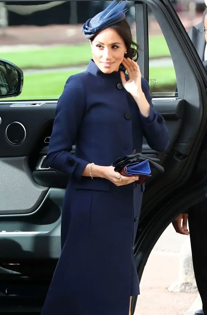 Prince Harry and Meghan Markle's 'foolish superstition' with being pregnant that 'horrified' King Charles' employees 1 The Duchess of Sussex gets out of the car in a wedding guest dress with a blue coat