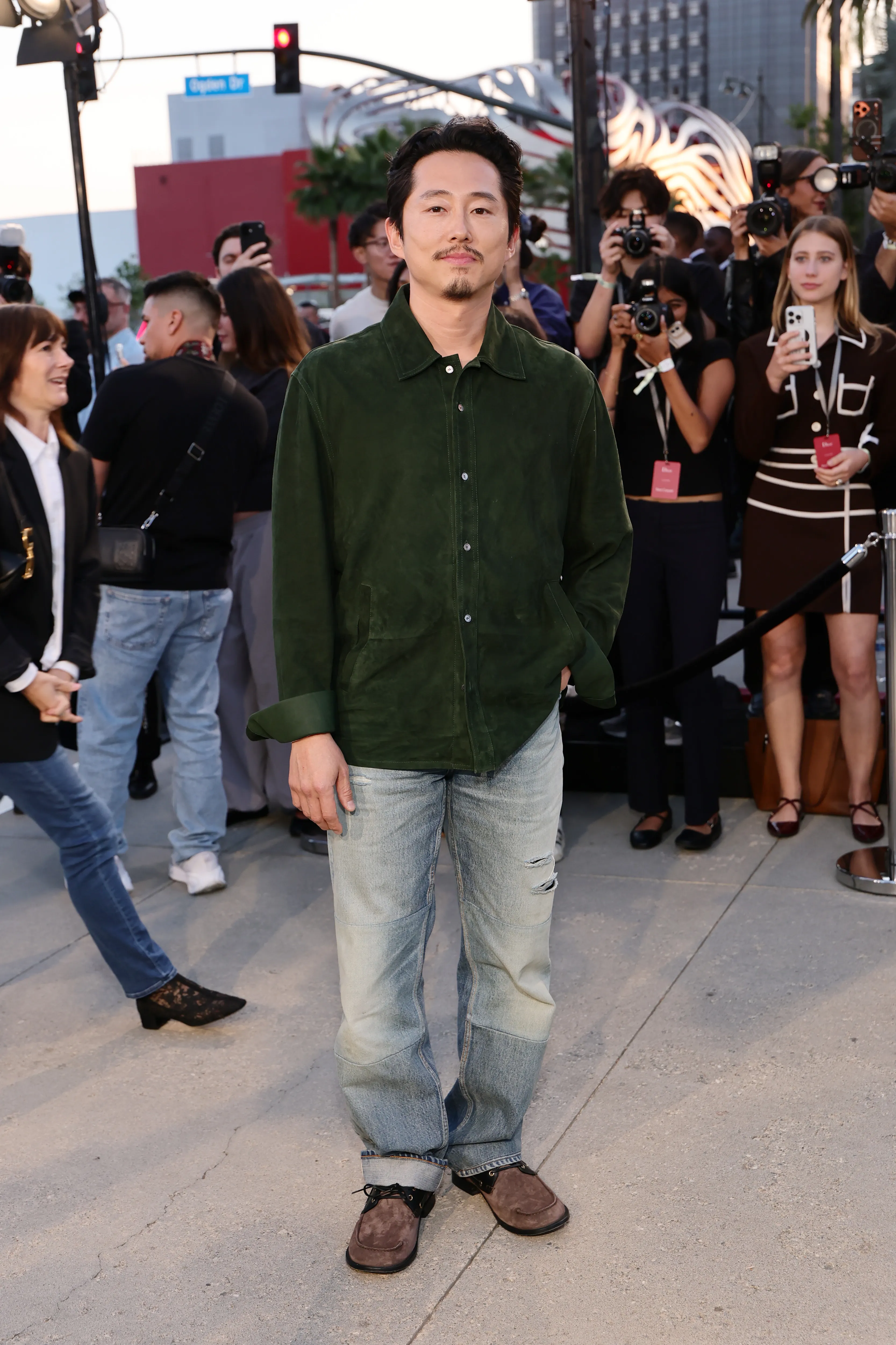 Steven Yeun attends the Dior 2027 Cruise collection show at the Los Angeles County Museum of Art