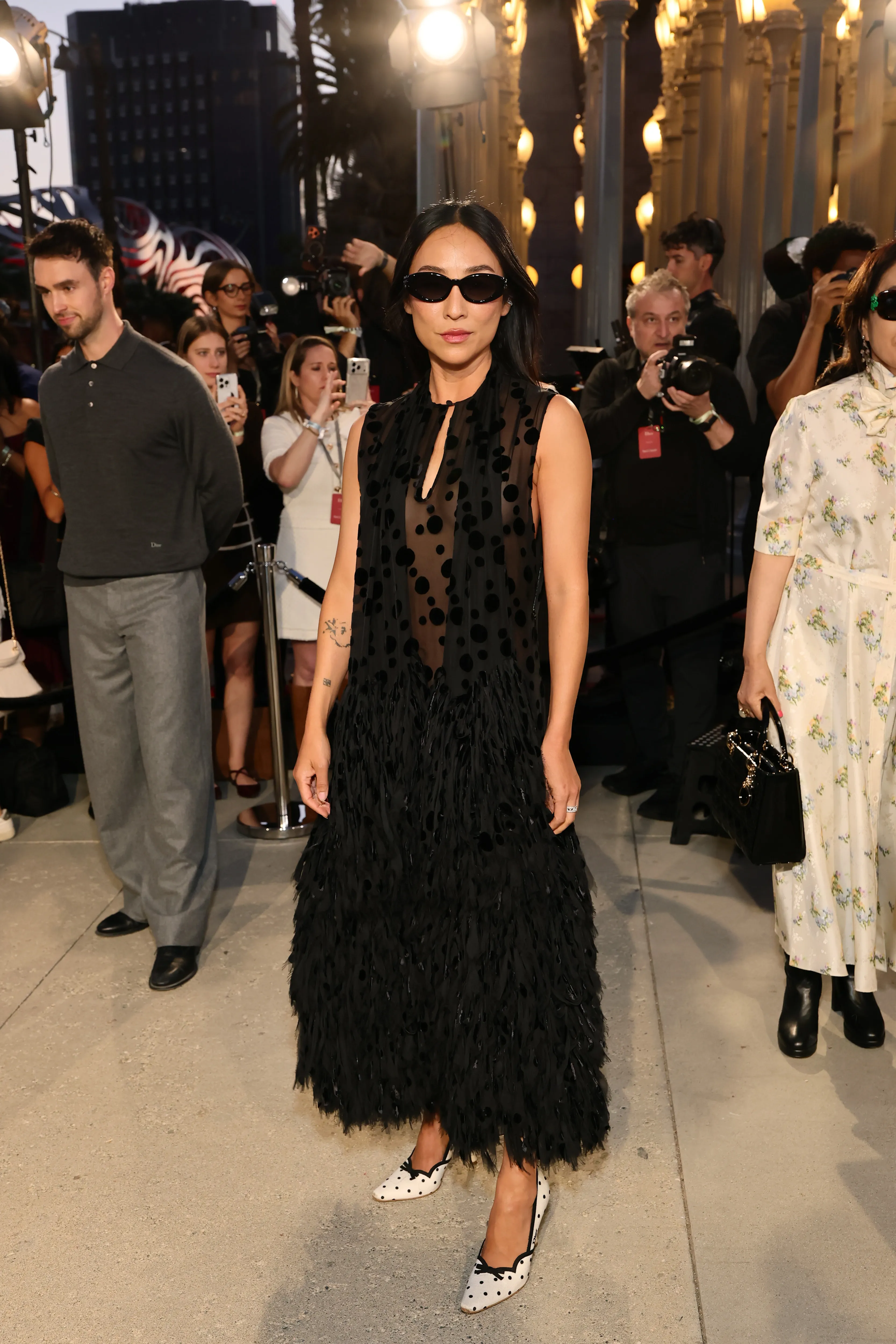 Greta Lee attends the Dior Cruise 2027 fashion show at the Los Angeles County Museum of Art