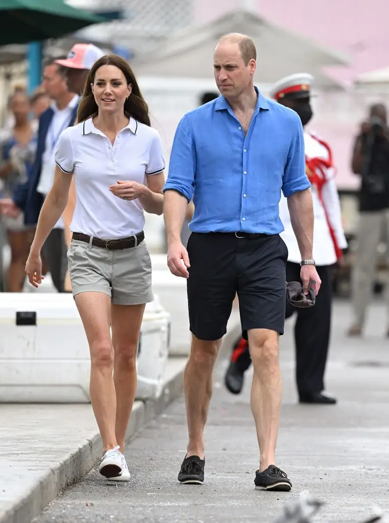 Kate in shorts with William outside