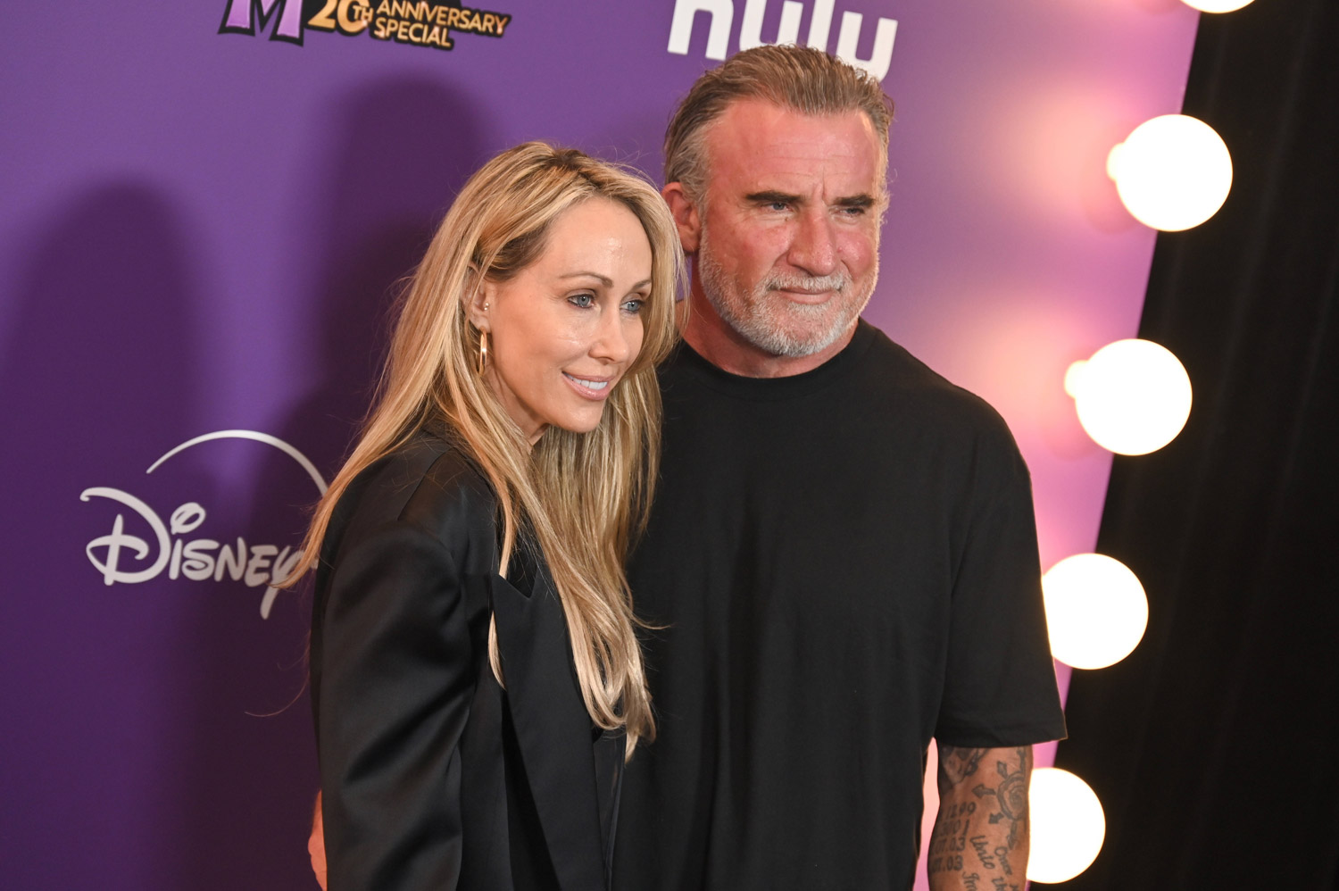 Tish Cyrus and Dominic Purcell at the world premiere of Disney's Hannah Montana 20th Anniversary Special at the El Capitan Theater in Los Angeles. March 23, 2026
