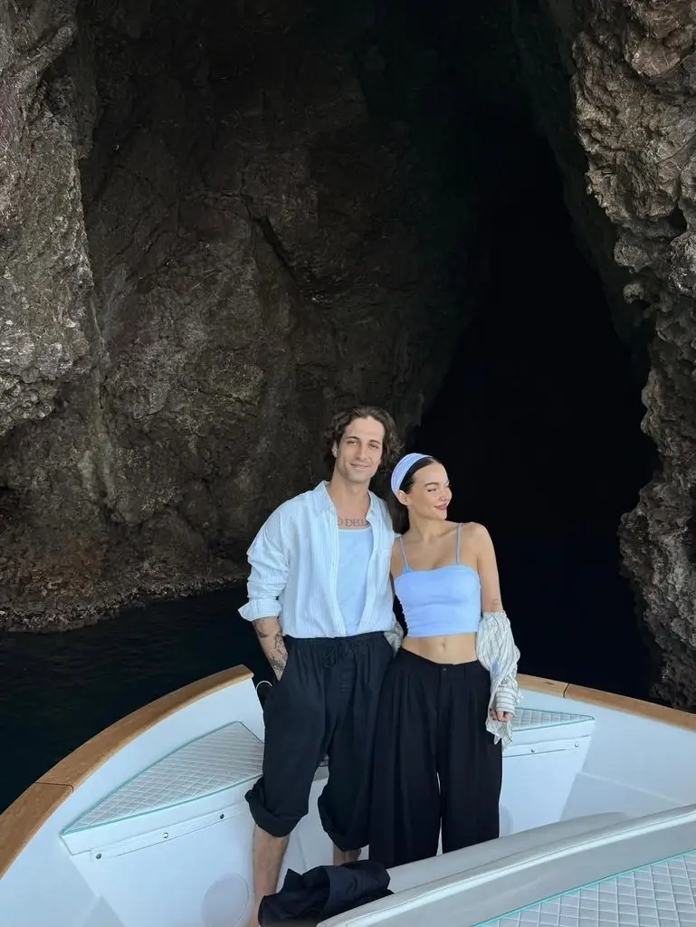 Dove Cameron wows in her tiny blue bikini whereas on trip in Italy with fiancé Damiano David 1 The couple went on a trip to Italy together