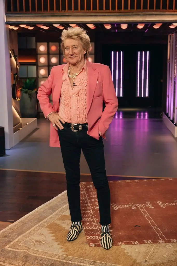 Rod Stewart in a peach colored suit