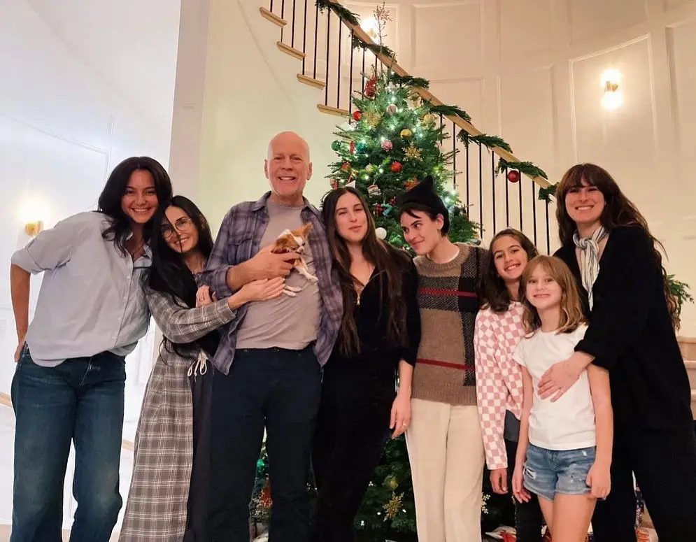 Demi Moore's Daughter Tallulah Highlights Her Mother's Spectacular Transformation in Then and Now Photographs 2 Demi Moore with Bruce and his family in front of the Christmas tree