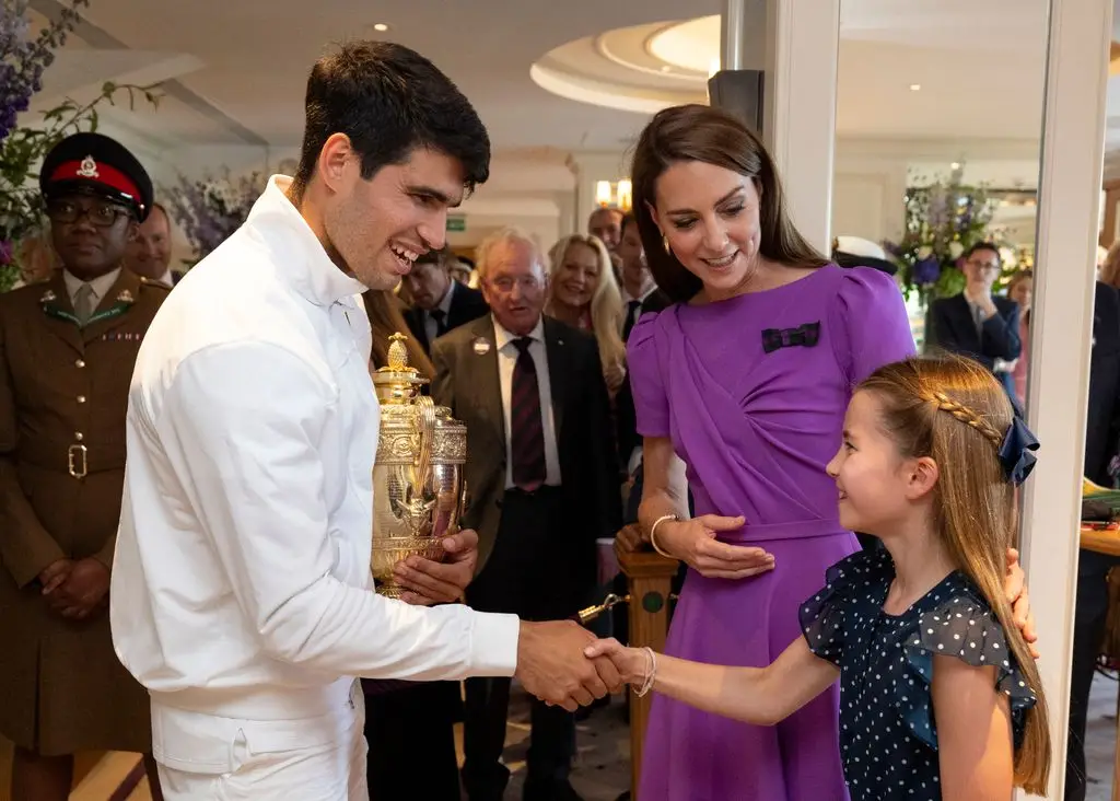 Carlos Alcaraz shakes hands with Princess Charlotte at Clubhouse after his victory against Novak Djokovic 