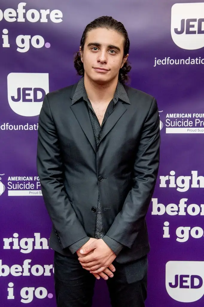 Jake Cannavale wears a black suit at the benefit show 
