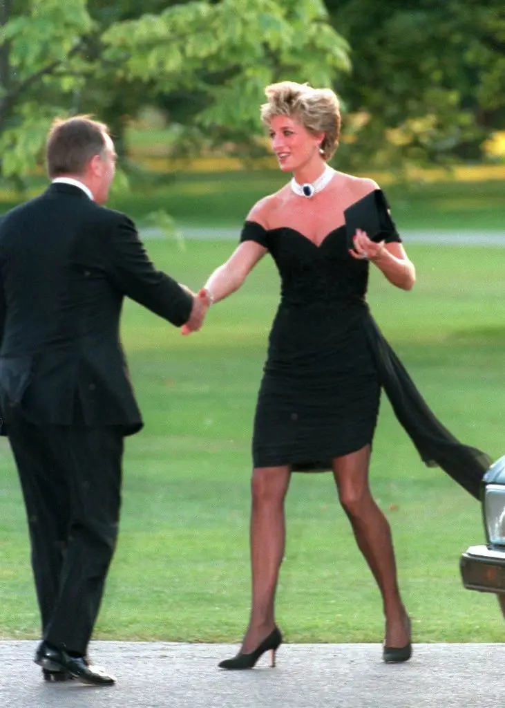 Diana, Princess of Wales, wearing a stunning black dress commissioned by Christina Stambolian, attends the Vanity Fair party at the Serpentine Gallery