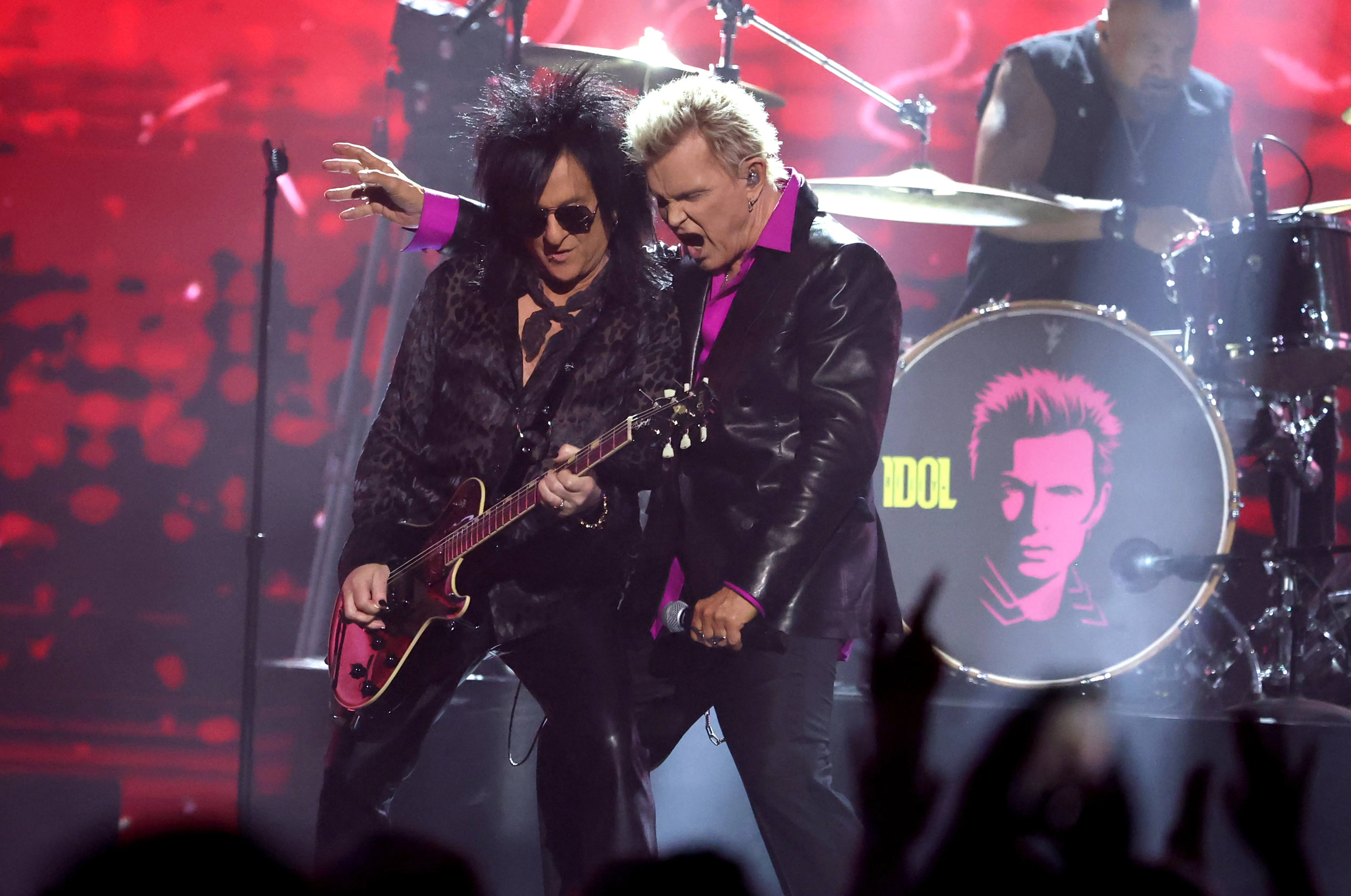 Steve Stevens and Billy Idol performed on stage.