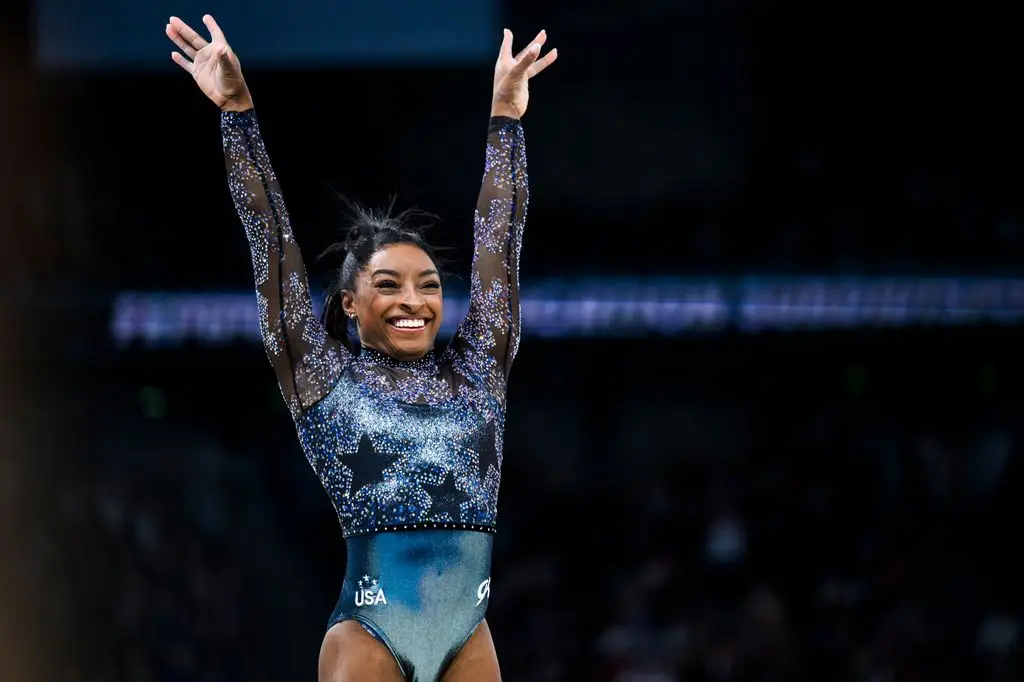 Simone Biles of Team USA reacts after her exercise on the beam during day two of the Paris 2024 Olympic Games at Bercy Arena on July 28, 2024 in Paris, France. 