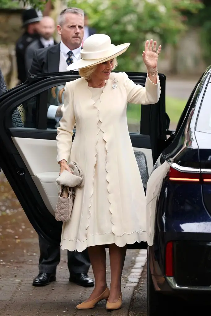 Peter Phillips and Harriet Sperling share their first romantic kiss after a fairytale marriage ceremony 9 Queen Camilla waves as she gets out of the car