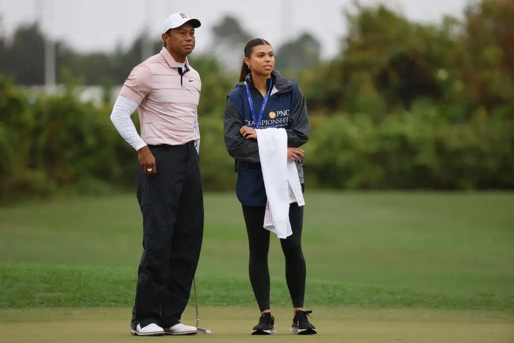 Tiger Woods with his daughter Sam Woods on the third green during the first round of the PNC Championship 