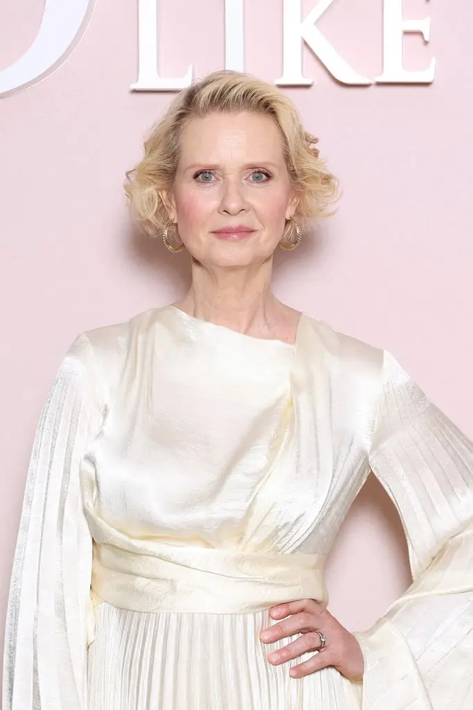 Cynthia Nixon in a draped and pleated cream silk dress at the third season photo call for 