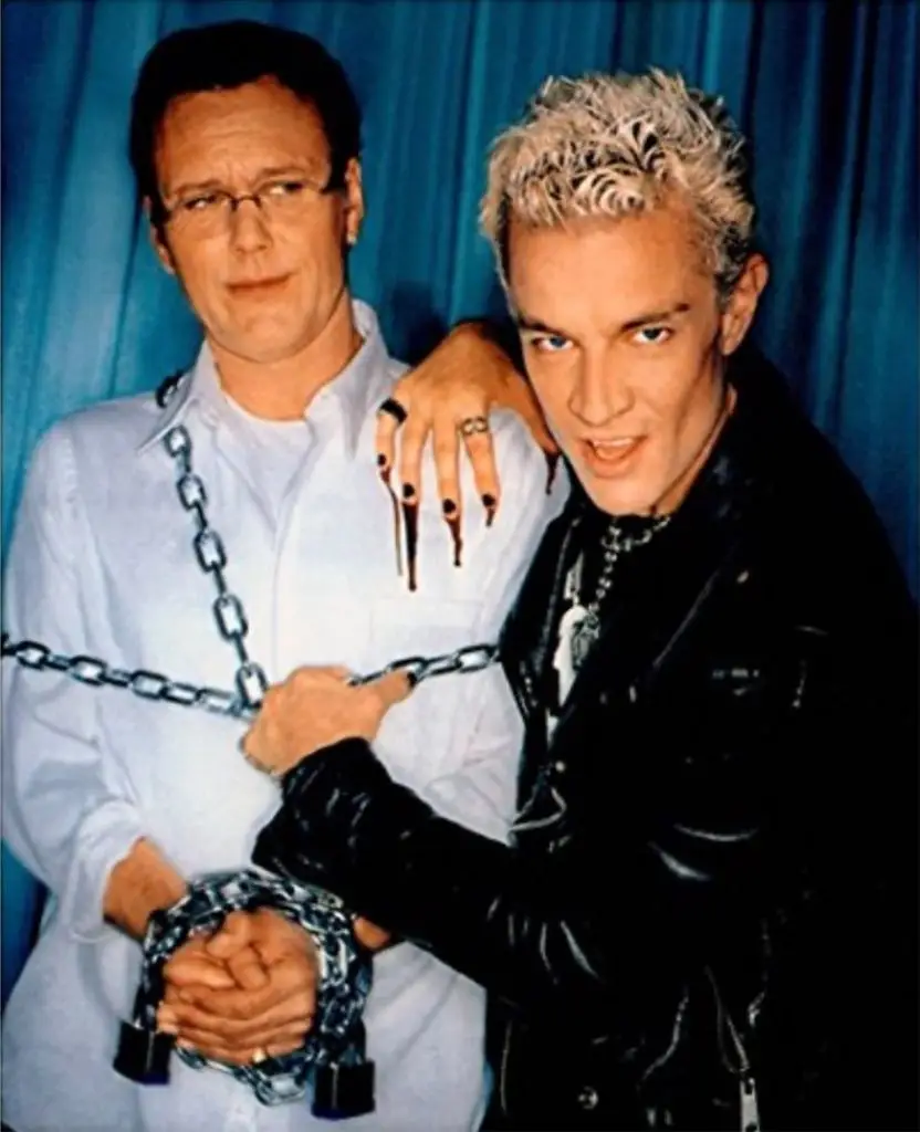 Anthony Head and James Marsters pose for a photo; Anthony is chained