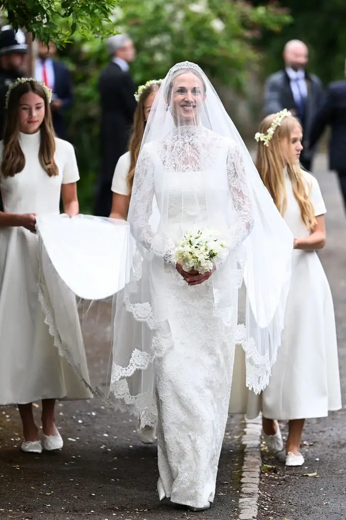 Peter Phillips and Harriet Sperling share their first romantic kiss after a fairytale marriage ceremony 2 Harriet Sperling wearing a white wedding dress with her three bridesmaids behind her