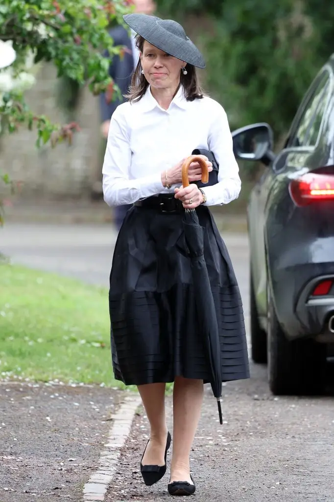 Peter Phillips and Harriet Sperling share their first romantic kiss after a fairytale marriage ceremony 15 Lady Sarah Chatto walking with an umbrella