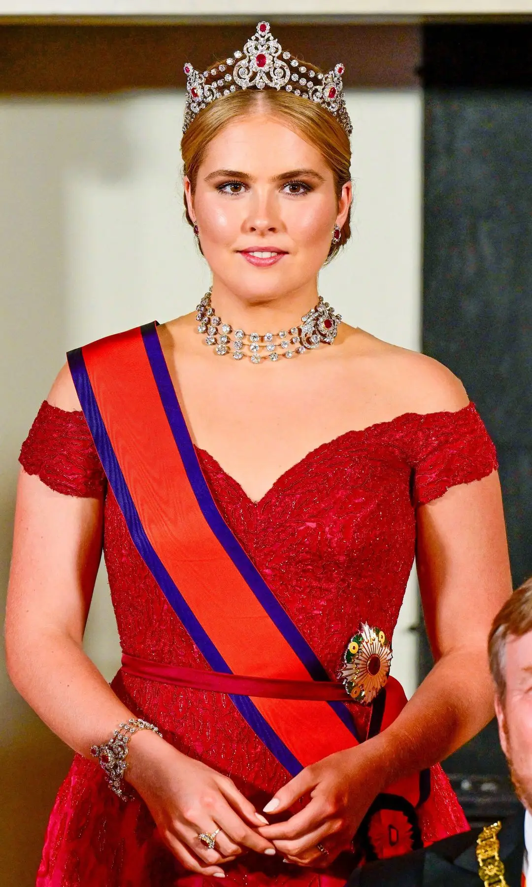 Princess Catharina Amalia standing in a red dress and ruby ​​tiara