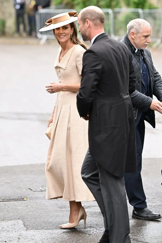 Peter Phillips and Harriet Sperling share their first romantic kiss after a fairytale marriage ceremony 7 Catherine, Princess of Wales and Prince William, smiling and walking together