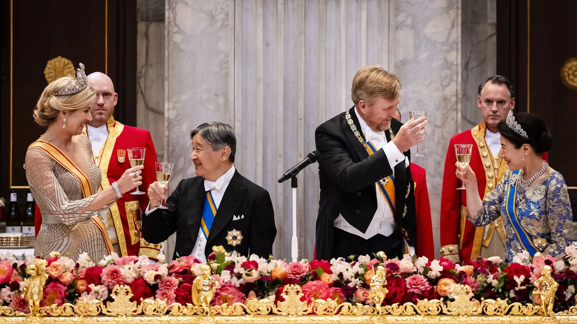 Queen Máxima, Willem-Alexander, Crown Prince Naruhito and Masako Owada toast with wine at an official event.