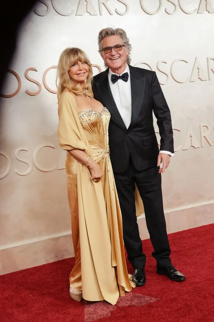 Goldie Hawn reveals what would influence her relationship with Kurt Russell 3 goldie hawn kurt russell golden dress black suit