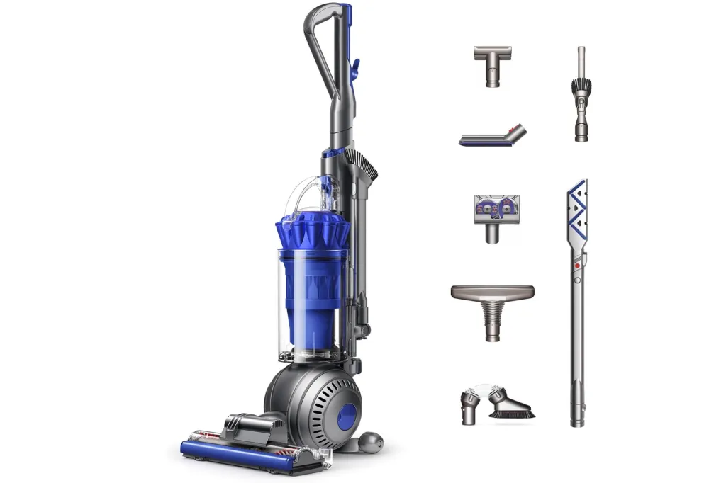 What to Purchase and Keep away from Procuring on Prime Day, In response to Skilled Customers 11 A blue and silver Dyson stick vacuum cleaner with various accessories.