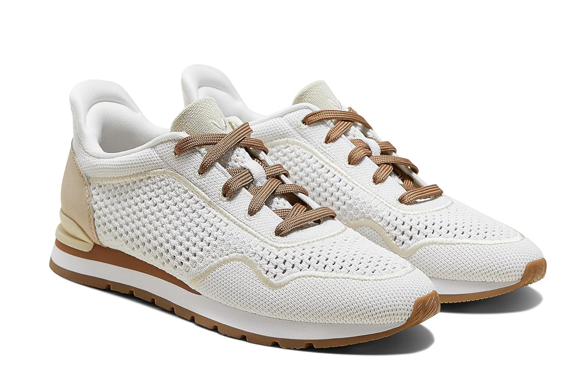 Pair of white mesh sneakers with laces and brown soles.