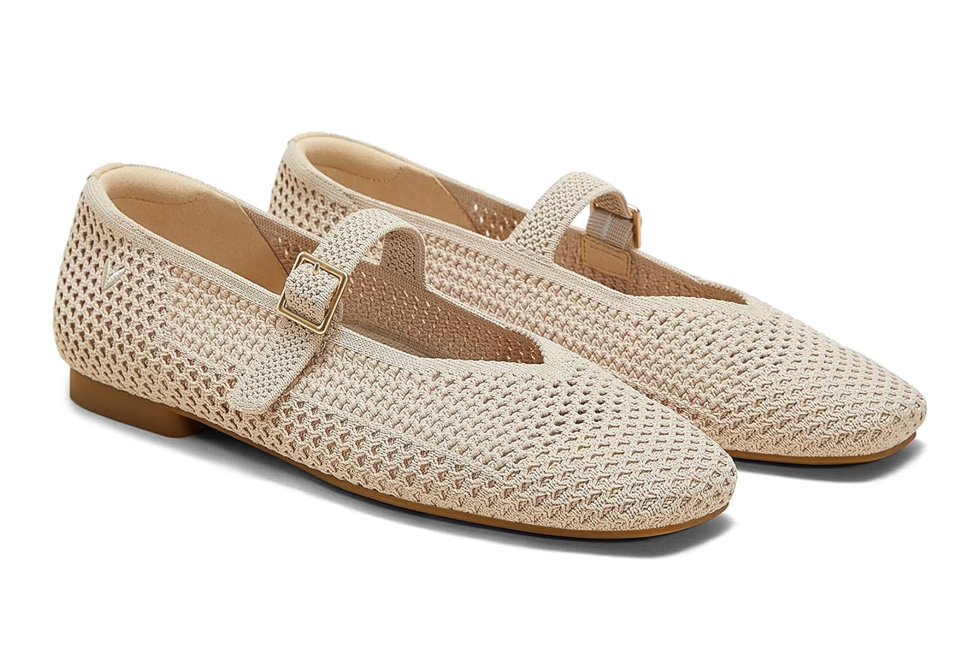 Pair of beige knit Mary Jane ballerinas with buckled straps.