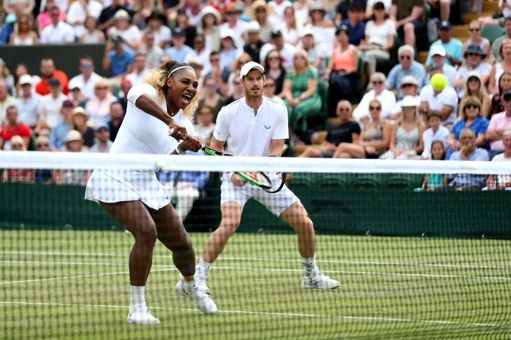 Serena Williams and Andy in action during one of their mixed doubles matches at Wimbledon in 2019