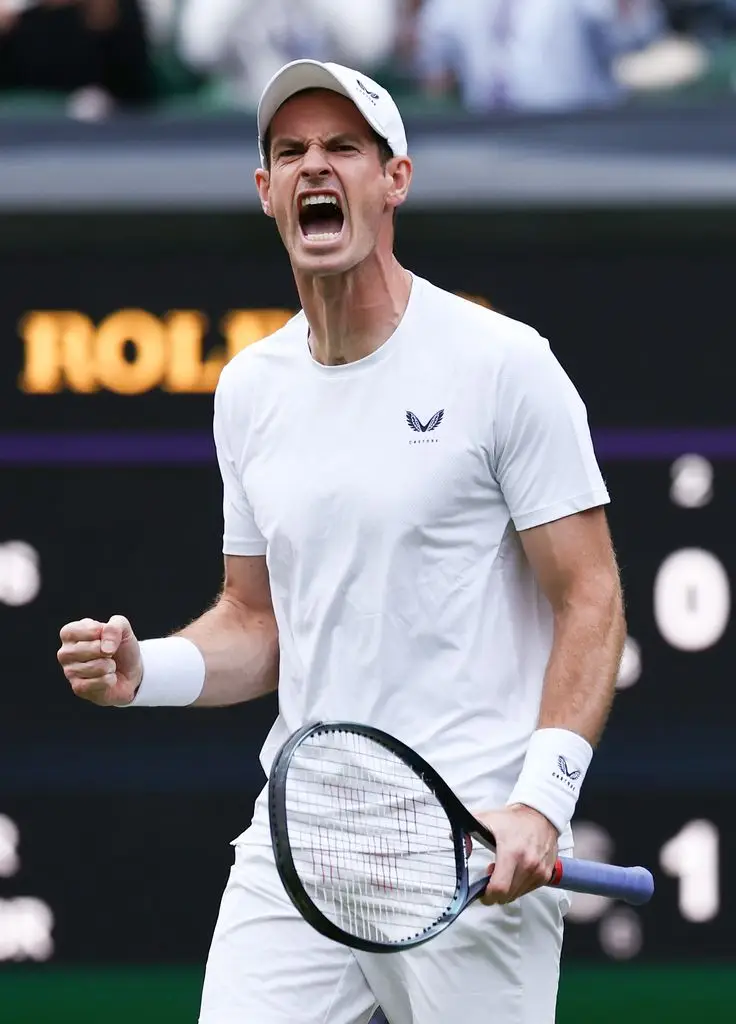 Andy Murray celebrates his victory while playing with Jamie Murray